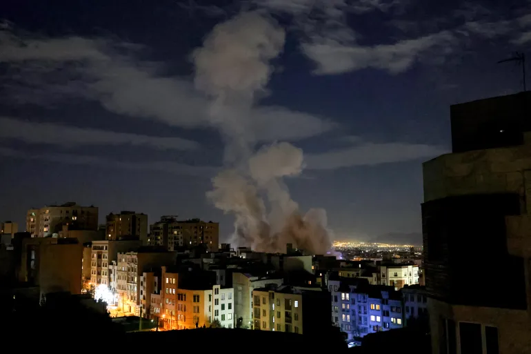 Smoke rises after a missile strike on Tehran