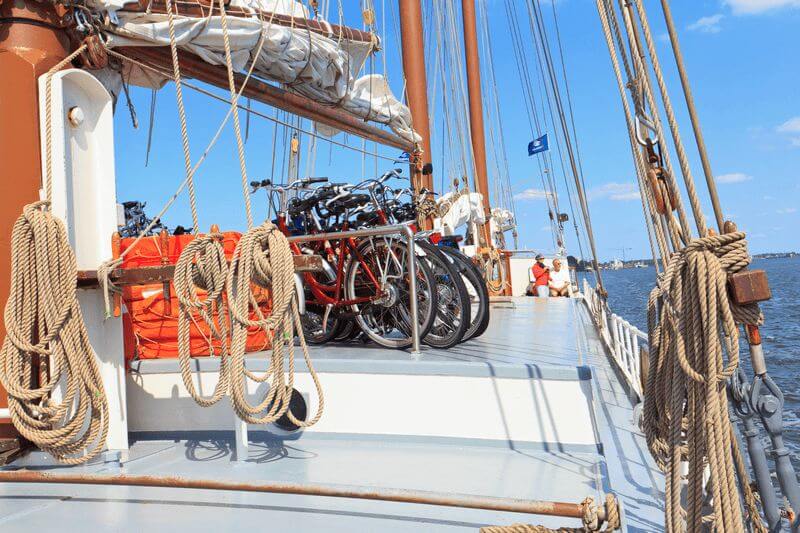 Several bicycles being carried on a sailing ship
