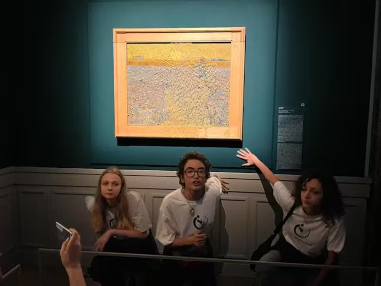 Italian climate activists with a soup-smeared Van Gogh painting in Rome
